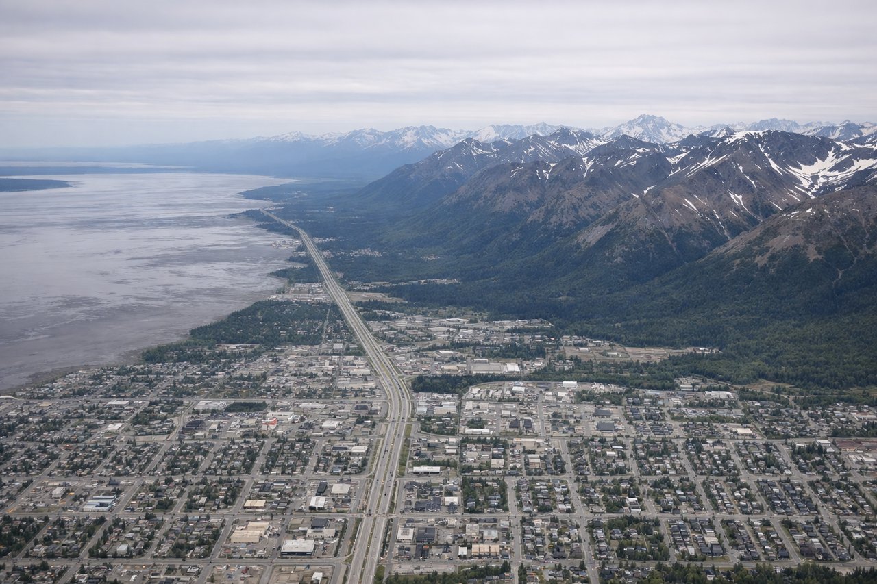 Aerial window seat view during takeoff from Anchorage (right side) — Turnagain Arm, Chugach Mountains, Cook Inlet, Kenai Mountains