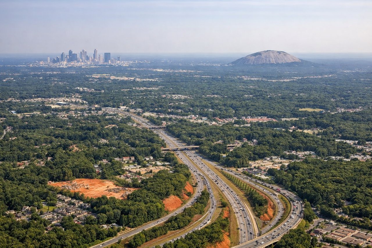 Aerial window seat view during landing at Atlanta (right side) — Downtown Atlanta skyline, Stone Mountain, Chattahoochee River, Piedmont suburbs