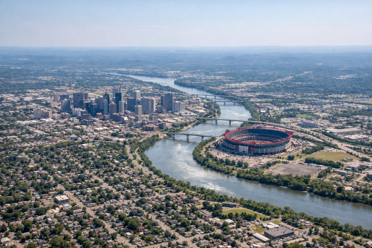 Right window seat view during takeoff from Nashville (BNA) — Downtown Nashville skyline (AT&T Building, Nissan Stadium), Cumberland River, Percy Priest Lake (briefly, further east), Vanderbilt/Belmont area rooftops