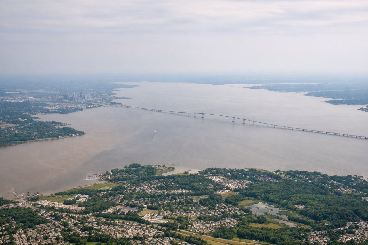 Left window seat view during takeoff from Baltimore (BWI) — Baltimore Inner Harbor, Fort McHenry, Patapsco River, M&T Bank Stadium/Camden Yards skyline