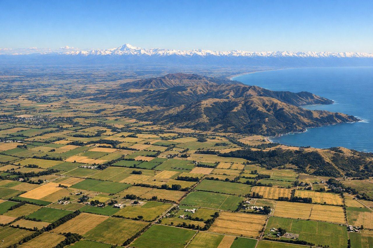 Aerial window seat view during landing at Christchurch (right side) — Southern Alps peaks, Canterbury Plains, Rakaia River valley, Banks Peninsula