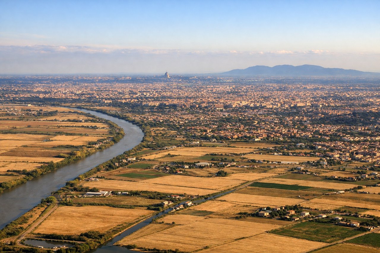 Aerial window seat view during landing at Rome (left side) — Apennine Mountains (eastern horizon), Tiber River valley, Rome urban sprawl, Pontine Marshes and coastal plains to the west