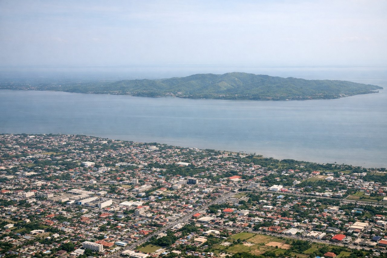 Right window seat view during takeoff from Iloilo (ILO) — Guimaras Island, Iloilo Strait, Negros Island coastline, Mount Kanlaon (distant, weather permitting)