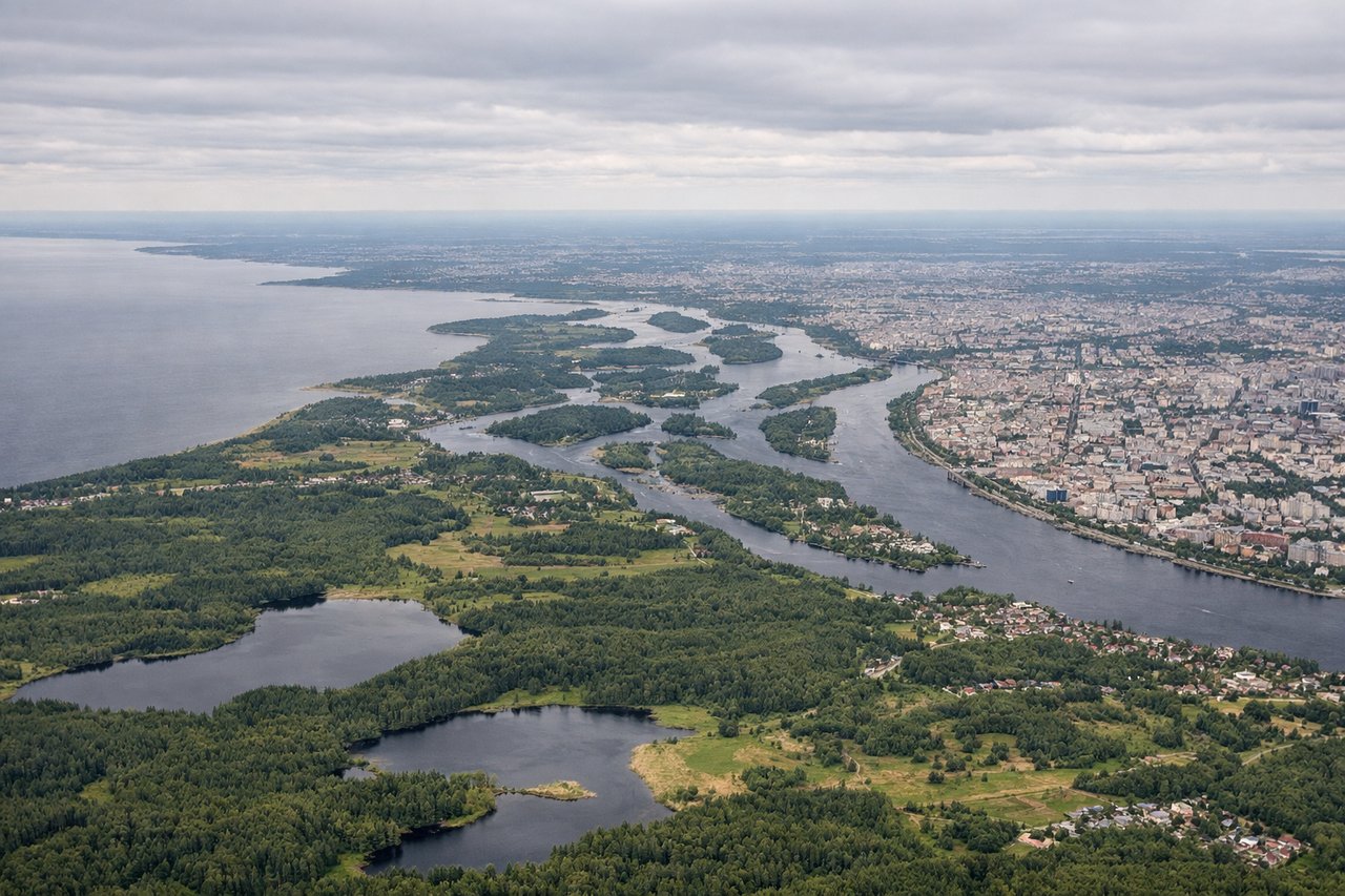 Left window seat view during landing at St. Petersburg (LED), Gulf of Finland (north), Neva River delta and waterfront, Vasilievsky Island, Petrogradsky District