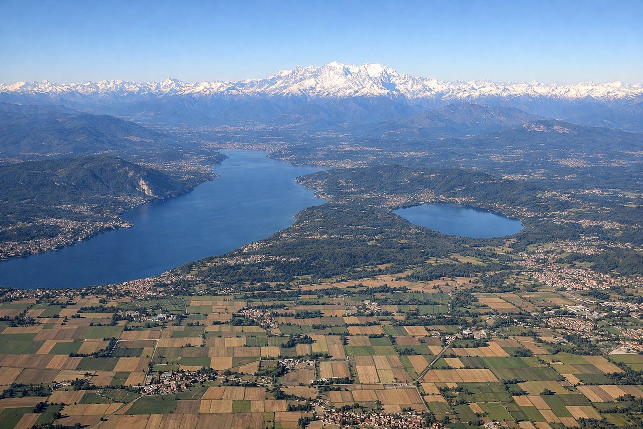 Aerial window seat view during takeoff from Milano (right side) — Southern Alps (Monte Rosa, Gran Paradiso massif), Lake Maggiore to the northwest, Po River valley floor, Ticino River gorge