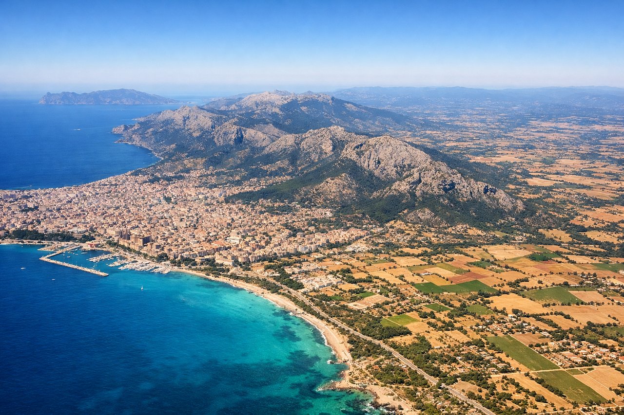 Left window seat view during takeoff from Palma De Mallorca (PMI) — Bay of Palma, Palma city skyline and Cathedral (La Seu), Bellver Castle, Serra de Tramuntana mountain range
