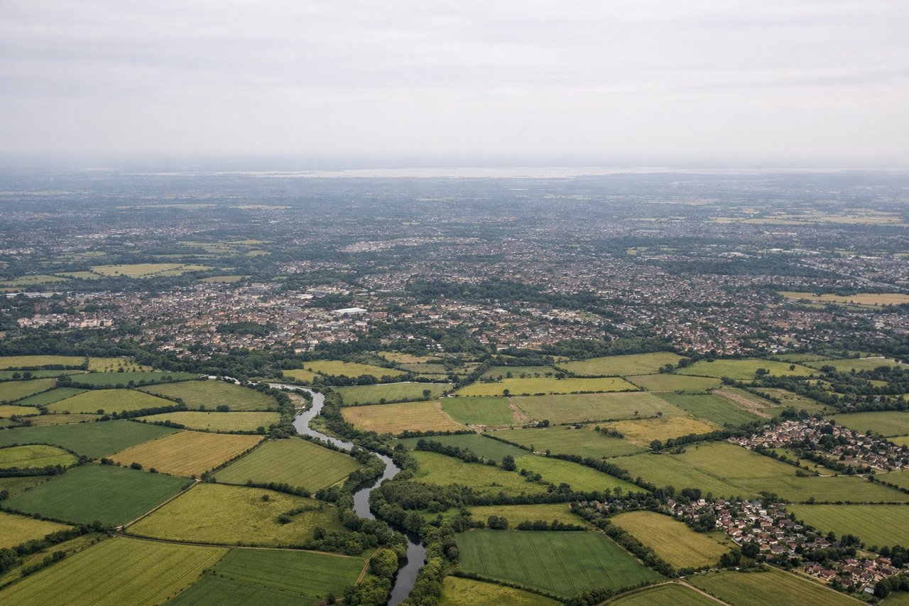 Aerial window seat view during takeoff from London (right side) — Thames Estuary, North Sea coastline, Essex marshlands, Southend-on-Sea area