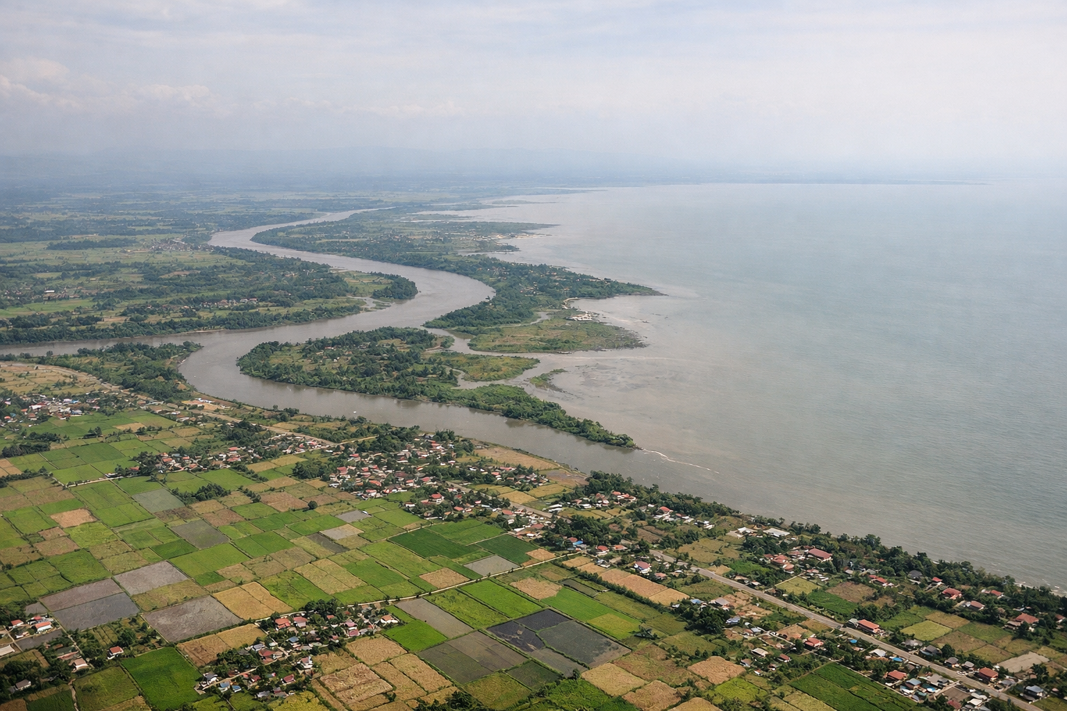 Aerial window seat view during landing at Cebu (right side) — Cebu City skyline, Mactan-Cebu and Marcelo Fernan bridges, Cebu Strait, Cebu Island's central mountain ridge