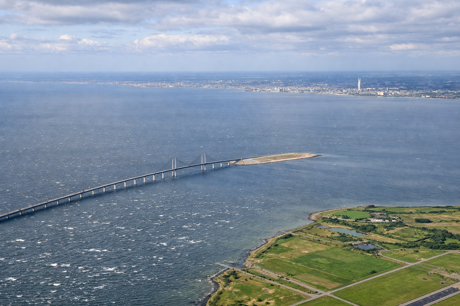 Aerial window seat view during landing at Copenhagen (right side) — Öresund Bridge, Malmö skyline, Öresund Strait, Amager island coastline