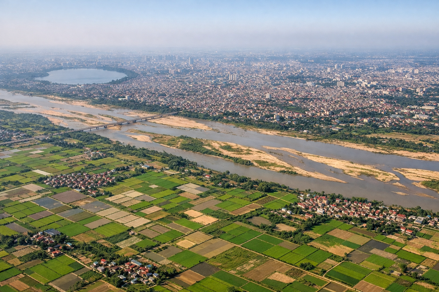 Aerial window seat view during takeoff from Hanoi (left side) — Red River delta, Tam Dao hill range, patchwork rice paddies near Hanoi